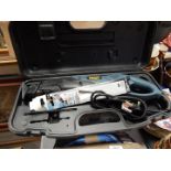 A Powercraft electric saw, PRS-600D, boxed, with two saw blades.