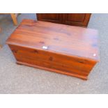 A stained pine blanket chest, 40cm H, 88cm W, 41cm D.