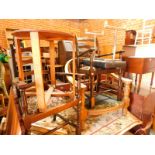 An early 20thC oak tub nursing chair, seat cushion lacking, together with a pair of oak ladder