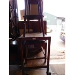 An early 20thC oak two tier trolley, 63cm wide, 43cm deep, 71cm high, a red stained mahogany two