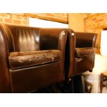 A set of four dark brown leather tub chairs. (AF)