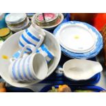 A TG Green blue banded Cornish ware mixing bowl, two cream jugs and a mug, further blue banded