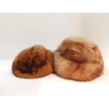 Two lady's fur hats.