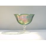 A Continental green lustre pedestal fruit bowl, raised on a single knopped stem and conical foot,