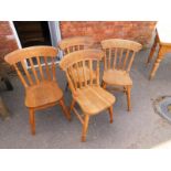 A set of four Victorian oak and elm bar back kitchen chairs.