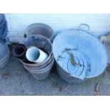 A galvanised wash tub, eleven galvanised buckets, and a galvanised watering can, lacking rose. (13)