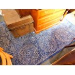 A modern John Lewis Cadiz rug, blue patterned, 240cm x 170cm. (RRP £320).