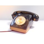 A British Telecom type 746F black cased telephone, dial bearing number for Holbeach 362573.