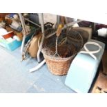 A wrought iron egg basket, wicker basket, three iron buckets, a Hoover vacuum cleaner, wooden