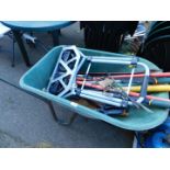 A wheelbarrow, sack truck and various garden tools. (quantity)