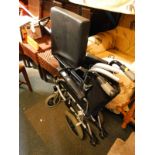 A collapsible Days wheelchair, model no 019440239, with padded seat and foot rests.
