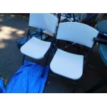 Two metal folding chairs.