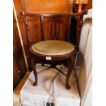 A Victorian mahogany tub chair, with pierced splat fabric seat and raised on cabriole legs, untied