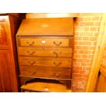 An Edwardian mahogany and satinwood cross banded bureau, the fall flap inset with shell paterea,