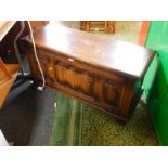 An oak blanket chest, with a triple linenfold panel front, raised on channelled square legs, 47cm H,