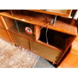 A 1950's Retro teak display cabinet, with two glazed doors, with an open recess, drawers lacking,