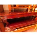 A Chinese red hardwood two tier occasional table, raised on bracket feet, 48.5cm H, 121cm W, 60cm