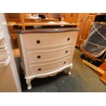 A white painted serpentine chest of three drawers, raised on cabriole legs, 81cm H, 76cm W, 39.5cm
