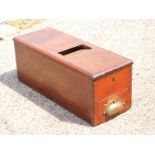 A mahogany cash box.