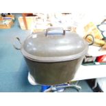 An oval twin handled cast iron cooking pot, No. 5, 35cm high,. 45cm wide, 26cm deep.
