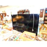 An LG 42" flat screen television, model number 42LH3000-ZA, serial number 908WRXL48818, with