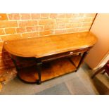 An oak bow fronted console table, raised on tapering square legs, united by an under tier, 66cm H,