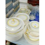 A Myott Son & Company Art Deco pottery dinner service, decorated with bands of grey and yellow,