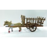 A child's mid 20thC horse and cart, 58cm W.