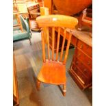 A Victorian beech lath back kitchen chair, with solid seat, raised on turned legs, united by an H