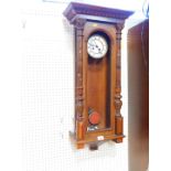 A German oak and pine cased wall clock, the circular brass dial with enamel chapter ring, bearing