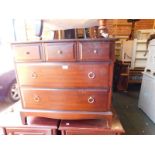 A Stag Minstrel chest, of three short over two long drawers, raised on bracket feet, 71cm H,81.5cm