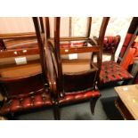 A set of six Regency style mahogany and red leather dining chairs, with burgundy coloured button