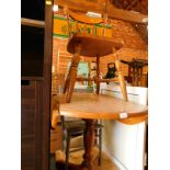 A pale oak drop leaf kitchen table, raised on a baluster turned column and X framed base, 75cm H,