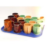Five Sylvac brown barrel mugs, five similar green ribbed mugs, three large brown glazed tankards
