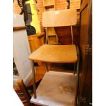 A retro mid 20thC bent wood and grey tubular metal child's school chair.