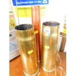 A pair of WWI 1918 9cwt brass shell cases, together with a copper lacquered brass shell case, MK1