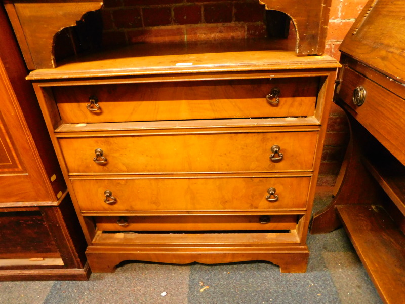 A walnut chest of four long drawers, with loop handles raised on bracket feet, 74cm H, 78cm W, 45.