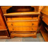 A walnut chest of four long drawers, with loop handles raised on bracket feet, 74cm H, 78cm W, 45.