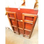 A set of mahogany and oak folding display shelves, with three shelves on hinged open sided supports,
