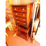 A mahogany bedside chest of four drawers, raised on bracket feet, 61cm H, 41cm W, 33cm D.,