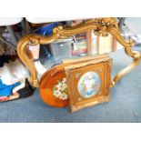 A rococo style gilt wood wall mirror, 84cm D, an oil on canvas of still life of flowers, and a