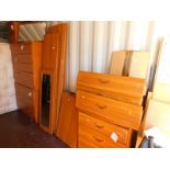 A group of MDF bedroom furniture, including three chests of drawers, two bedside chests and a