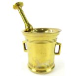 A brass pestle and mortar, 12cm diameter.