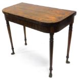 A late Regency rosewood D end fold over card table, the top with a triple wide crossbanding, with