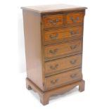 A 20thC mahogany narrow chest of two short and four long drawers, on bracket feet, 95cm high, 49cm