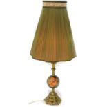 A Moorcroft lamp base, with a pleated shade on gilt metal and pottery support, decorated with pink
