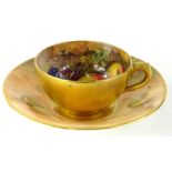 A Royal Worcester cabinet cup and saucer, by Edward Townsend, hand painted with brambles and apples,