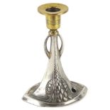 An Art Nouveau brass and chrome candlestick, in the manner of WMF, the inverted stem raised with