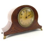 An Edwardian mahogany and boxwood strung mantel clock, the shaped case on metal stylised bracket