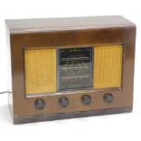 A mid 20thC walnut cased Bush radio, type ACII IOD120W, with meshwork speakers and front tuning